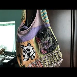 Purse with panda and small cell phone holder.